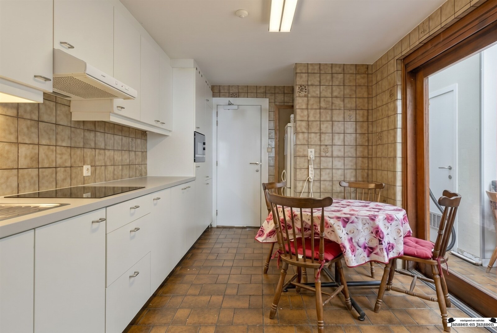 compact-white-kitchen-with-dining-area
